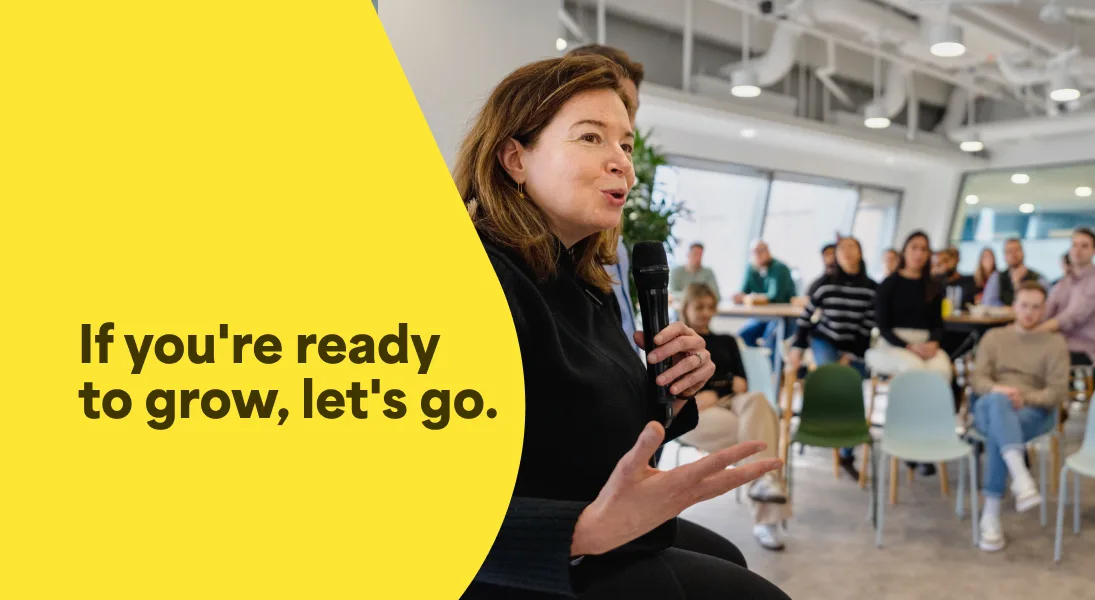 A photo of Alicia Skubick, Chief Customer Officer speaking at a company meeting in the Trustpilot office. The photo has an overlay of text that says If you're ready to grow, let's go.